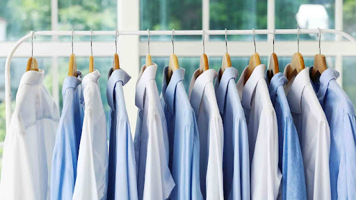 Shows a rack of suits at a eco-friendly dry cleaning service in Northern NJ
